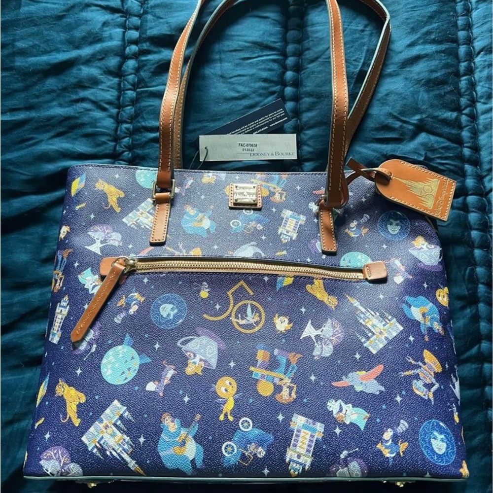 Brand new. Never used. Dooney Disney 50 year purse